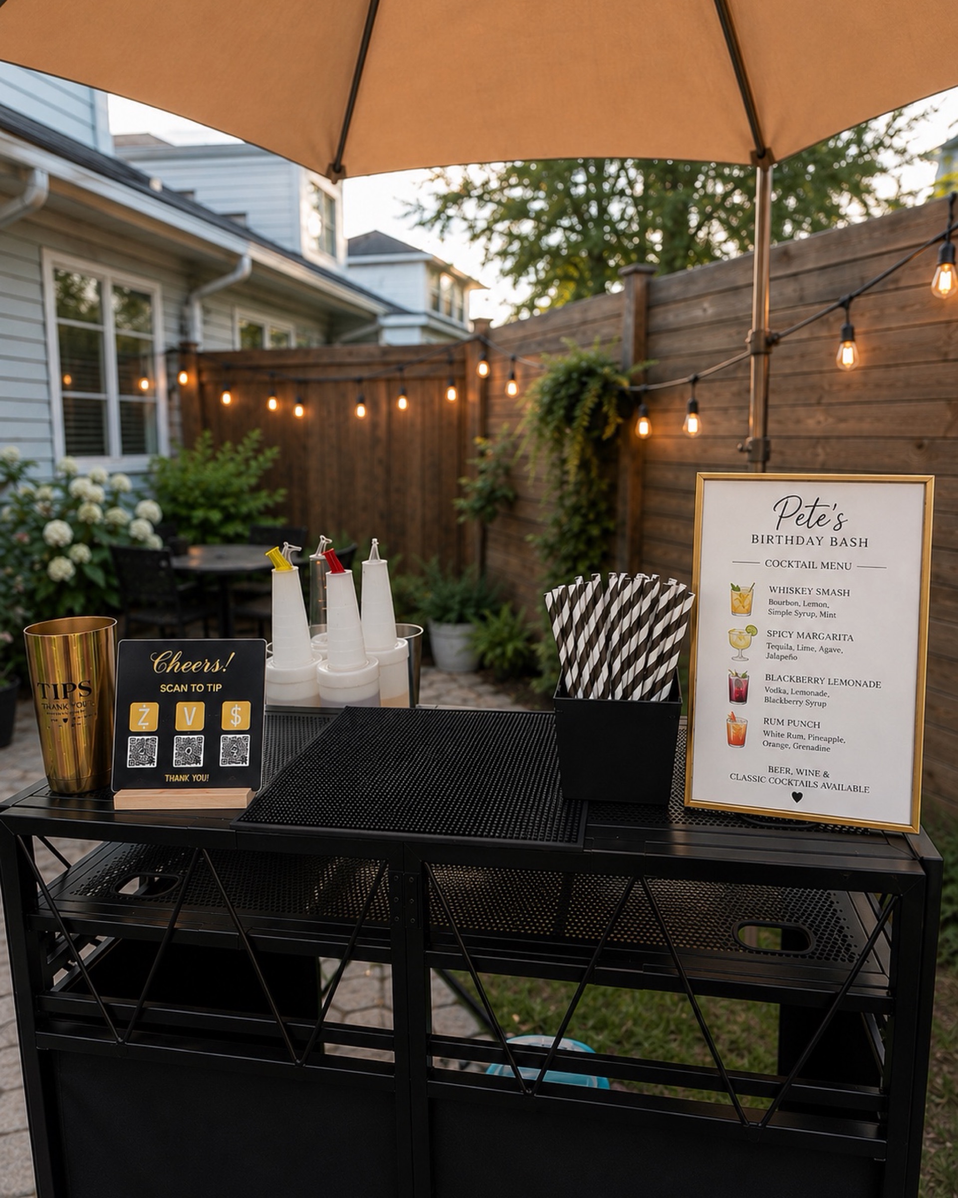 Sip & Slay backyard bar cart setup with custom cocktail menu and string lights